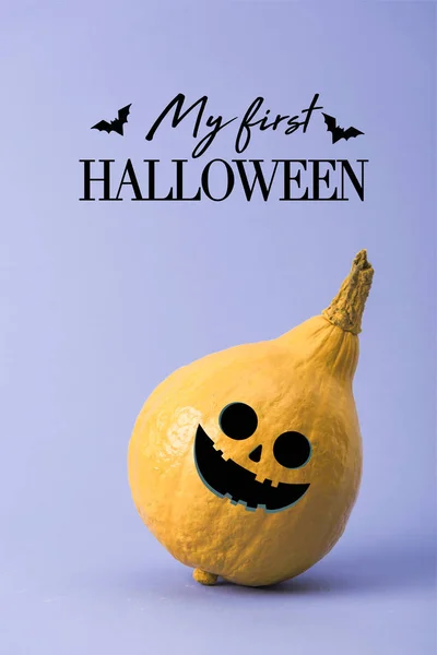 Yellow colorful painted pumpkin on violet background with my first Halloween illustration — Stock Photo