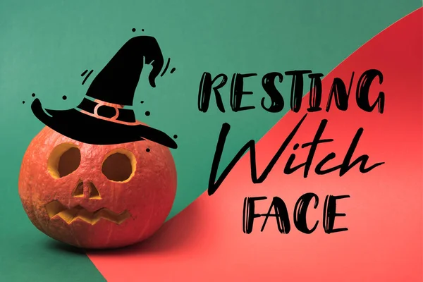 Spooky Halloween pumpkin on red and green background with resting witch face illustration — Stock Photo