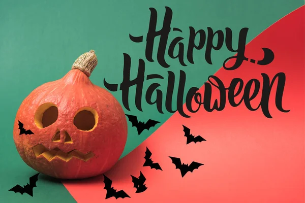 Spooky Halloween pumpkin on red and green background with happy Halloween illustration — Stock Photo