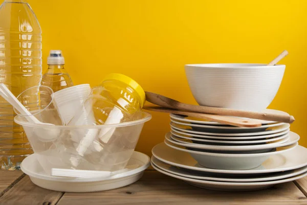 Plastic and Ceramic Stack dishes Recycle Concept Save Planet Yellow Board