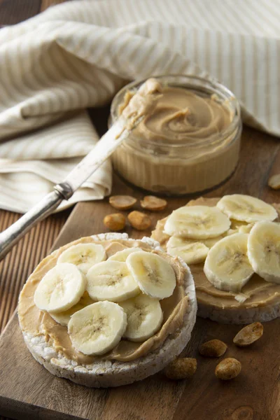 Proteine food - Peanut butter and banana on rice cakes, healthy, dietary food.