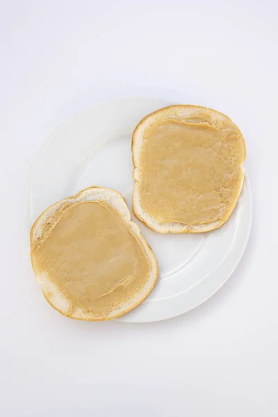 Peanut butter sandwich breakfast or snack on white background. — Stock Photo, Image