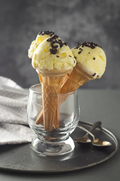 Ice cream cones in glass jar. Summer foods, vanilla ice cream dessert.