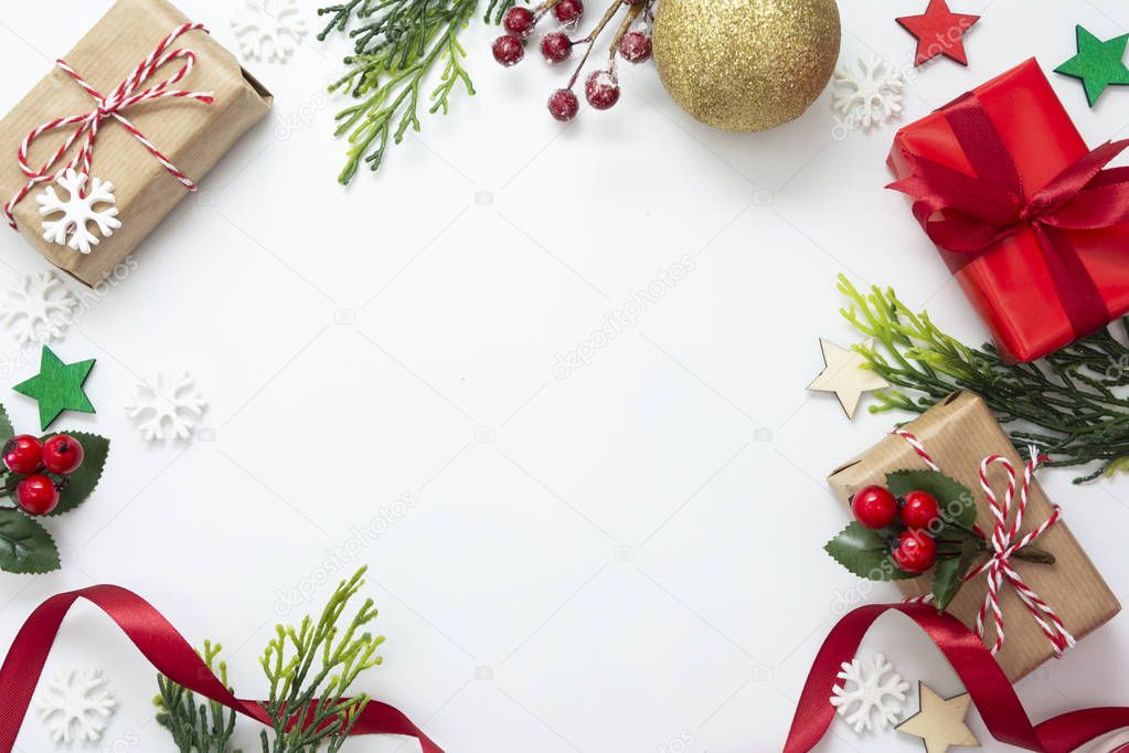 Christmas backgrond with gift boxes, red ribbon, winter decorations, isolated on white background. Christmas and New year concept. Mock up, copy space. Flat lay, top view.