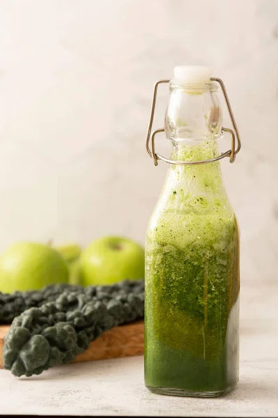 Healthy green smoothie with green fruits and vegetables. Detox, dieting, clean food eating