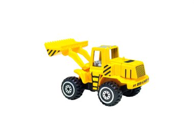 Beyaz arka plan üzerinde izole sarı inşaat kamyonu oyuncaklar kadar kapatın.