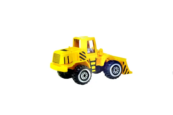 关闭在白色背景查出的黄色建筑卡车玩具 — 图库照片