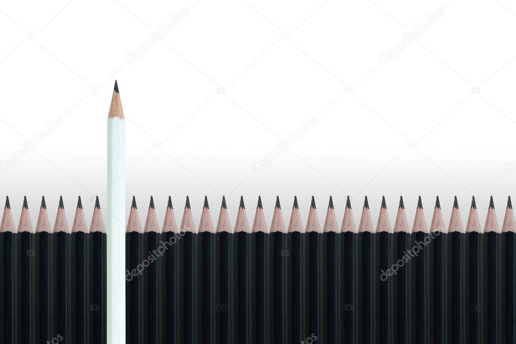 Business Leadership Concept : White pencil standing out from row of many black pencils on gray background.
