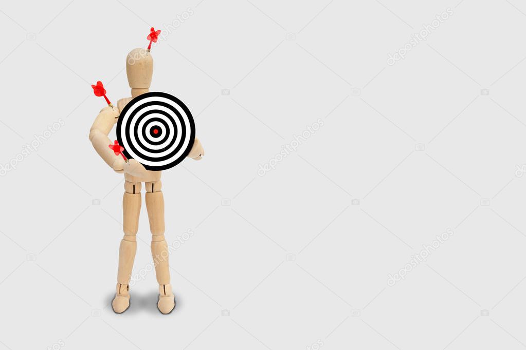 Business Marketing Concept : Many red darts missed hit target on dartboard isolated on gray background.