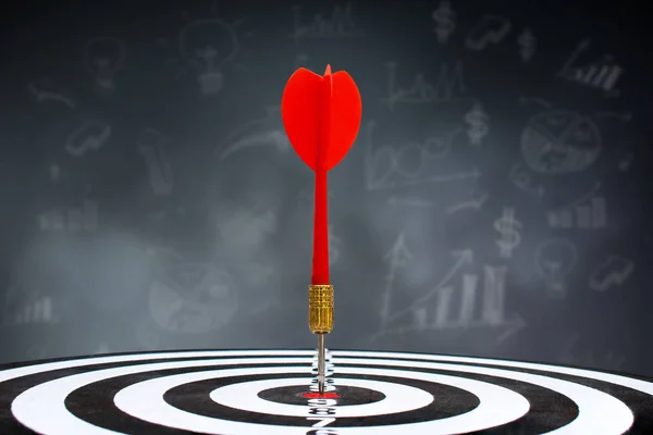 Business Marketing Concept : Red dart hit target on dartboard.