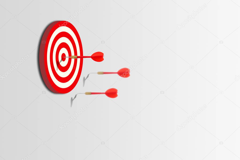 Marketing Concept : One of group red darts hit target on dartboard.