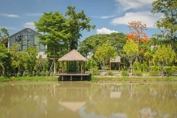 Tropical landscape view of Traditional waterfront wooden pavilion locate nearly lake.