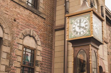 Antique vintage clock tower locate front of Otaru Music Box Museum at Hokkaido, Japan. clipart