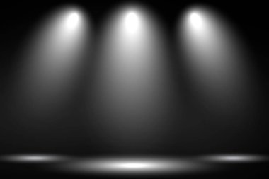 Siyah arka planda spot aydınlatmalı beyaz sahne. 