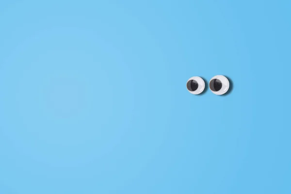 Abstract Image Cartoon Eyes Looking Left Side Blue Background — Stockfoto