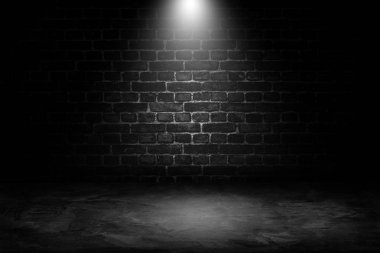 Abstract image of Spot lighting with black brick wall in background. clipart