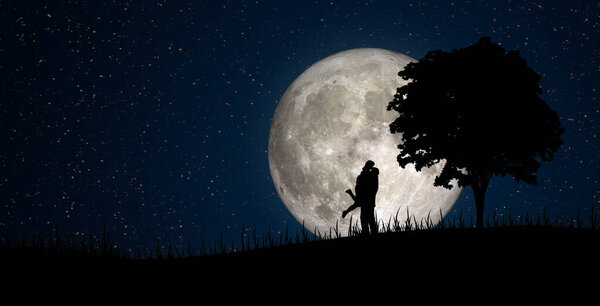 Happy Family Concept : Silhouette of Miniature people as lover standing on little hill with full moon in background. (Elements of this image furnished by NASA.)