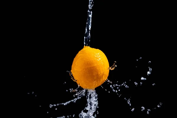 orange splash on black background