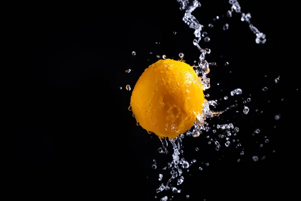 orange splash on black background