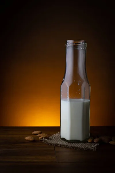 glass of milk on background