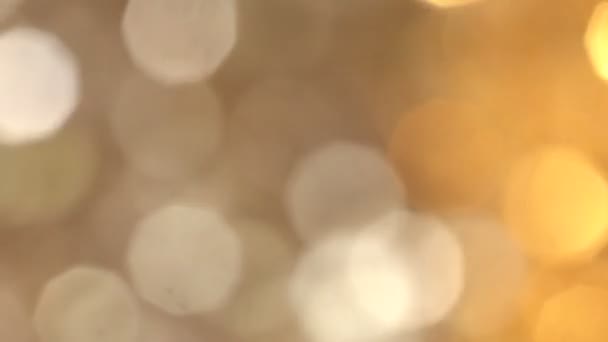 Abstract Gold bokeh lights in motion in 4k video. High quality render of gold particles. Ideal for Christmas, valentines day, wedding, love, celebration and party videos as background — Stock Video