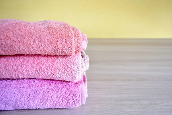 stack of towels on a light background order in the house concept