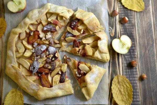 Homemade galette with apples plums and nuts