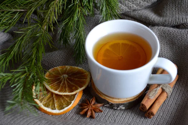 Cup Lemon Tea Dried Oranges Cinnamon Fir Branch Winter Holidays — Stock Photo, Image