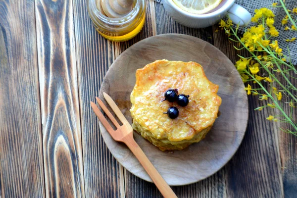 Stack of oatmeal pancake with honey and berries Healthy delicious breakfast