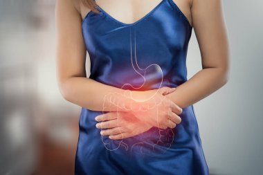 Asian woman in satin nightdress wake up for go to restroom, The photo of internal organs is on the women's body against toilet background, Healthcare and lifestyle concept. clipart