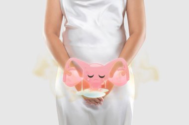 Vaginal discharge and vaginal odor of a female. Leucorrhoea. Illustration of the uterus smelly is on the woman's body. clipart