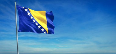Bosna-Hersek 'in ulusal bayrağı açık mavi gökyüzünün önünde rüzgarda dalgalanıyor