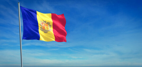 The National flag of Andorra blowing in the wind in front of a clear blue sky