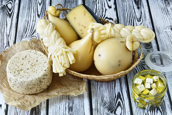 Different types of cheeses on a wooden background. Cheese platter. — Stock Image Different Types Cheeses Wooden Background Cheese Platter Stock Image