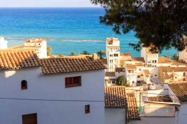View of the tiled roofs of Altea village, Alicante, Spain clipart