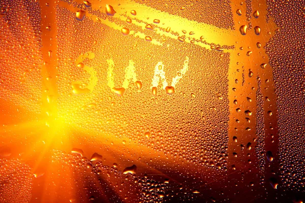 inscription sun on water bulbs on a window