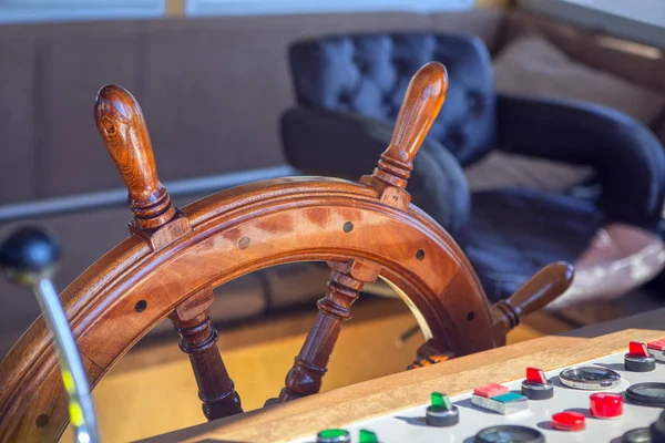 Wooden steering wheel on a ship
