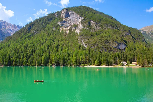 Spectacular Nature of Lake Prags in Italy . Boats on the Pragser Wildsee . Forest mountains and lake scenery