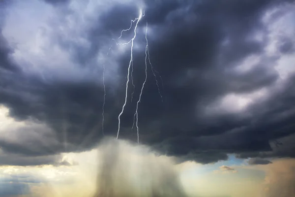 Heavy rain and lightning on the sky . Stormy weather with thunderstorm and sunlight