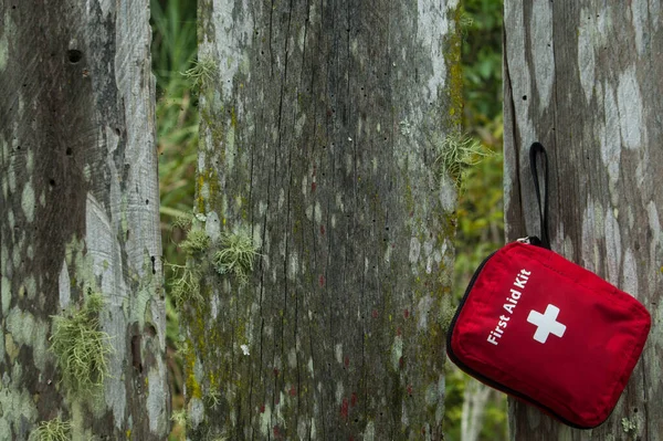 first aid kit bag on nature background