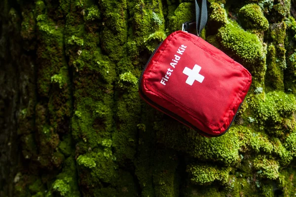 first aid kit bag on nature background