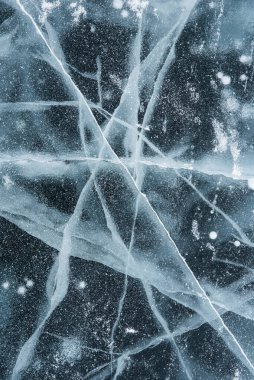 Ice texture close-up. Frozen Baikal lake in Siberia. Beautiful cracked ice with air and methane bubbles.  clipart