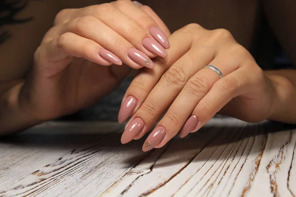 beautiful gel lacquer manicure on a textured trendy background