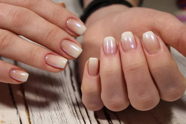 gentle light manicure on beautiful female hands