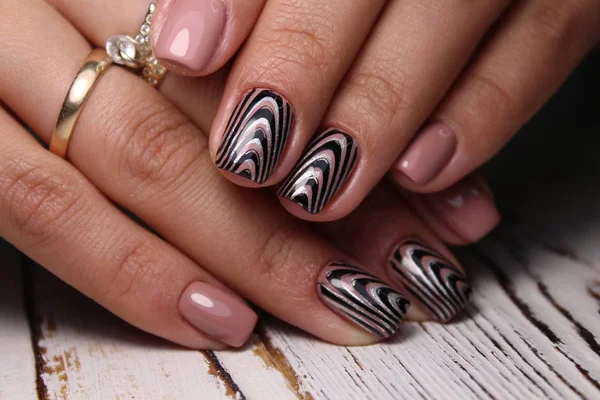 Trendy manicure design on a beautiful background.