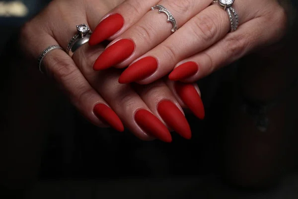 Beautiful manicure of nails on the background of a fashionable — Stock Photo, Image