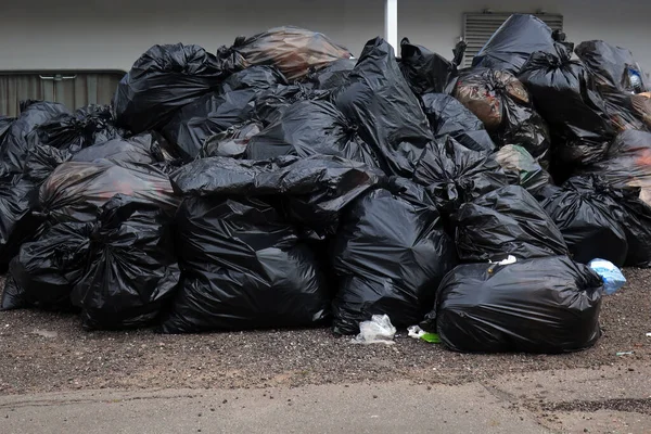 garbage packed in black plastic bags for landfill so as not to pollute the environment