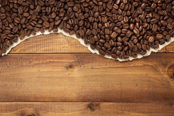 Kaffeebohnen Auf Holzgrund Draufsicht — Stockfoto