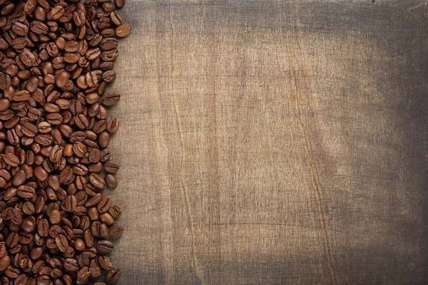 Kaffeebohnen Brett Auf Holzgrund Draufsicht — Stockfoto