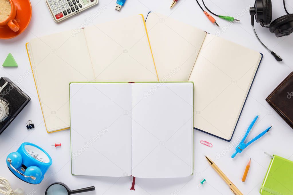 school accessories and notebook or book with empty pages on white  background, top view